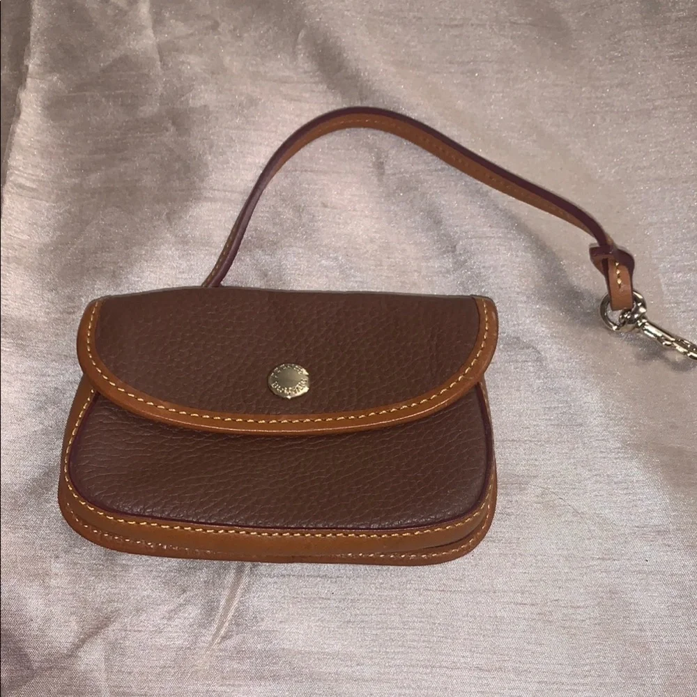 Dooney & Bourke Leather with Flap Closure and Wristlet NEVER USED LIKE NEW